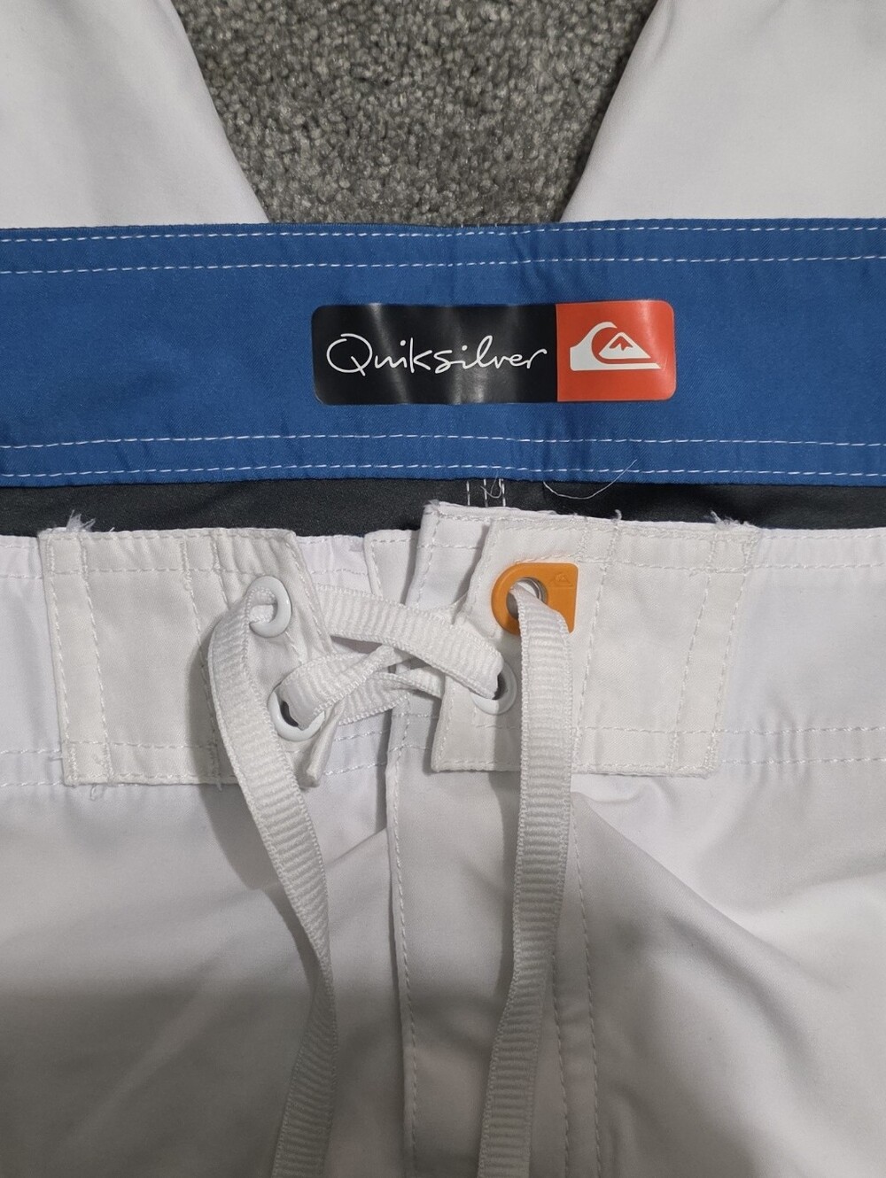 Quiksilver White Boardshorts with Blue Waistband and Orange Accent